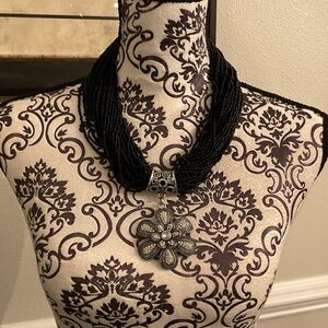 Elegant Black Beaded Necklace with Silver Floral Pendant